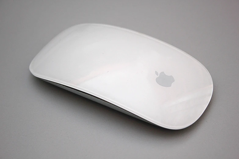 a white apple mouse with the logo on the back