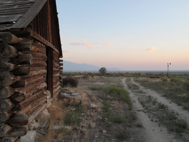 a path with buildings near by during sunset