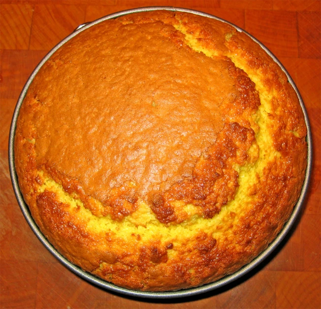 a well baked bread pie on a wooden table