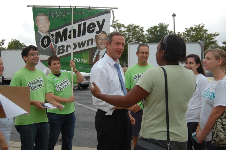 a group of people that are wearing shirts and ties