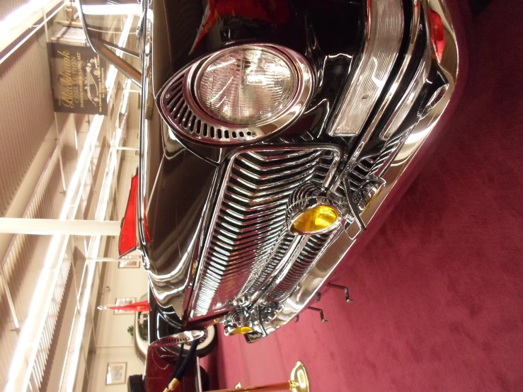 an intricate motor scooter being displayed at a museum