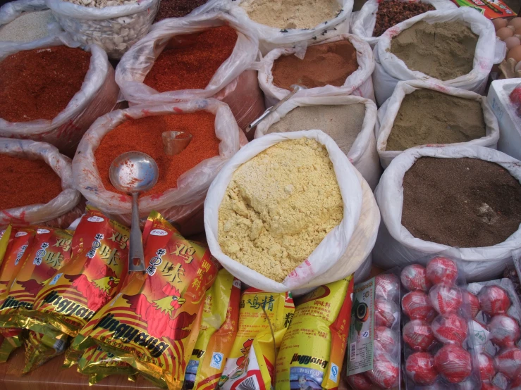 a market with a large amount of bags of various foods