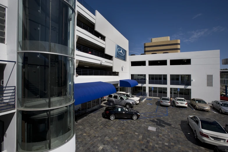 a parking lot with cars parked on the pavement