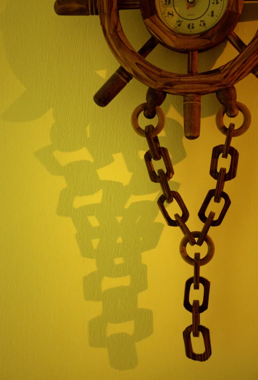the chain has been attached to the clock on the wall