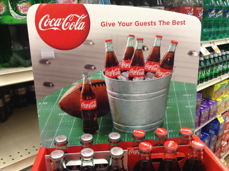 coca - cola advertit on shelf in store display