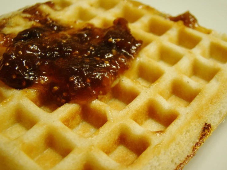 the waffle has a small pastry on it