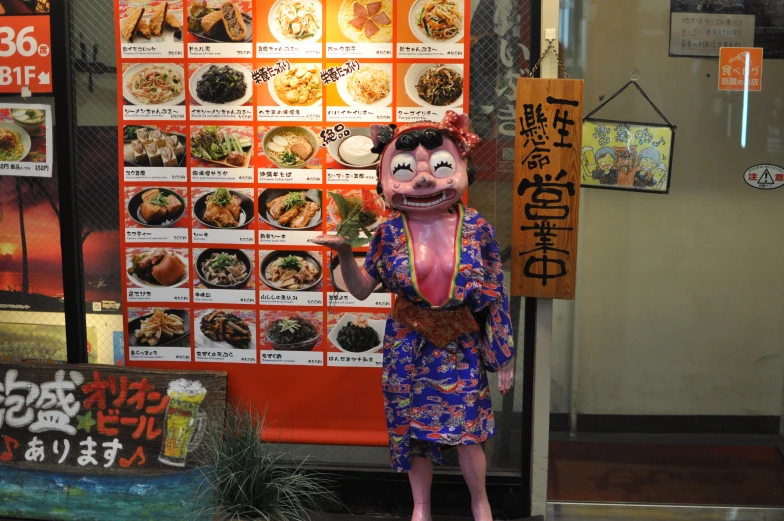 a man dressed in costume standing next to a menu