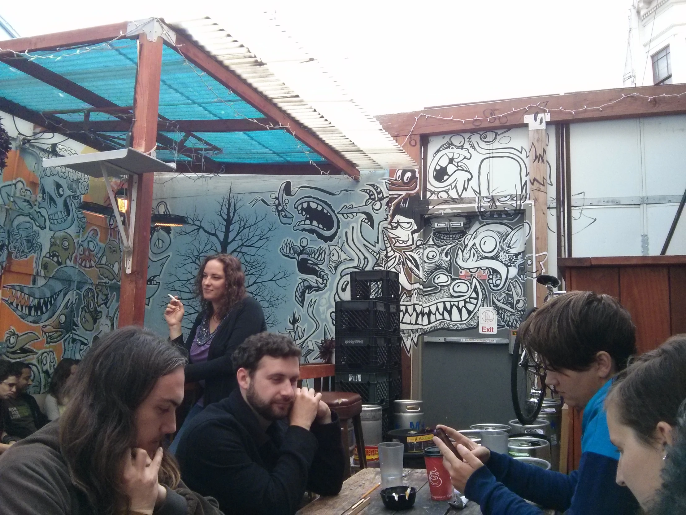 a group of people gathered together with drinks in their hands