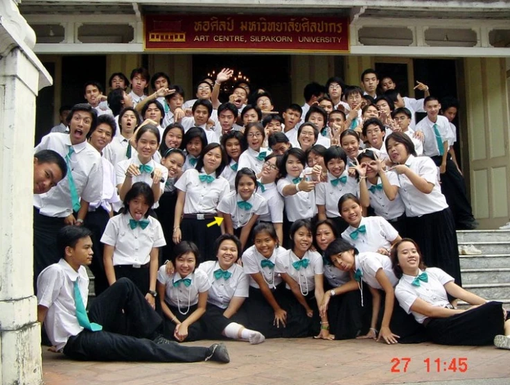 a group of school students posing for the camera