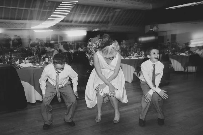 a group of children dance at a party