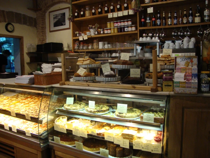 an image of bakery shop with cakes and pies