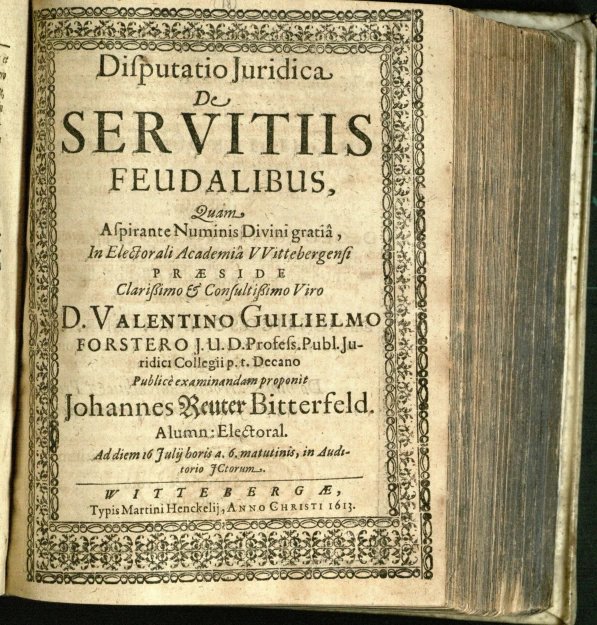 an open book showing an ornate text