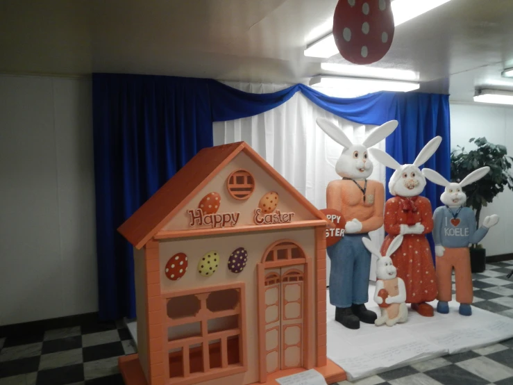 two bunny statues stand on the stage for the audience to watch