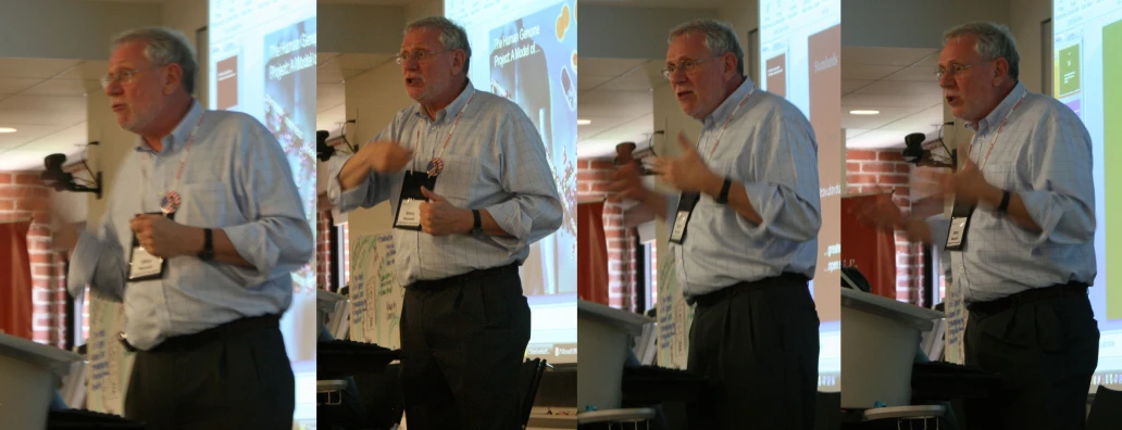 several ss of an older man standing at a podium