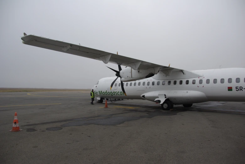 a white airplane is sitting on the tarmac