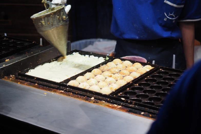 a man is serving a dessert on a table