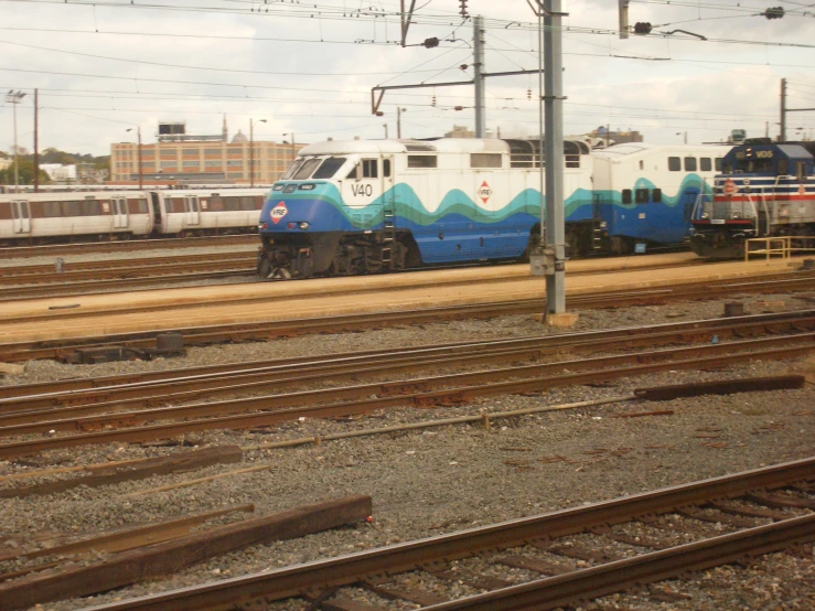 a long train that is sitting on the tracks