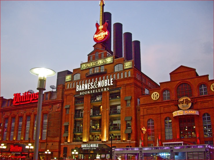 the front view of a large building with many lights