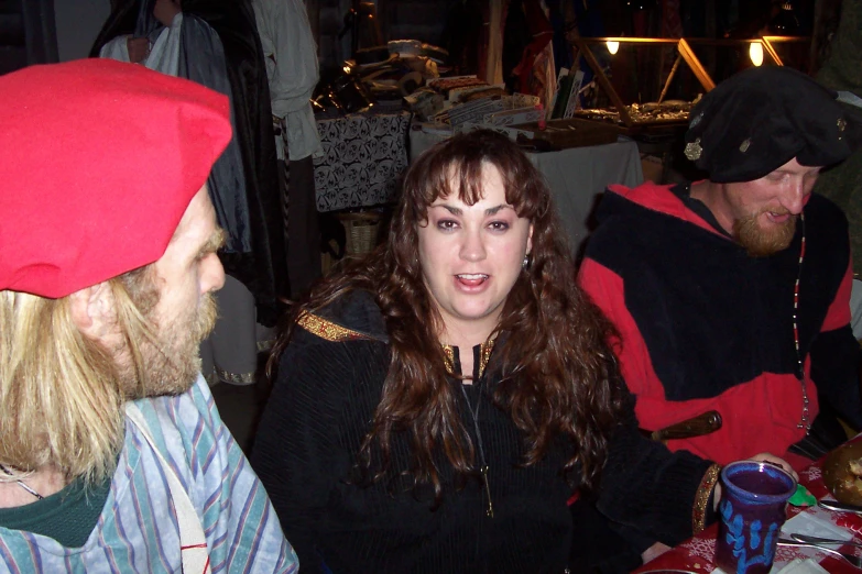 a woman sitting next to a group of people