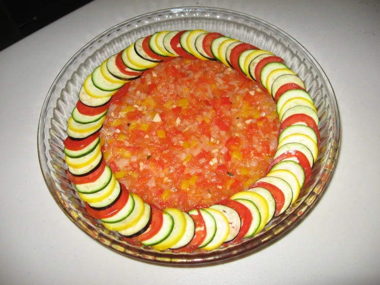 an empty bowl full of a mixture of colorful vegetables