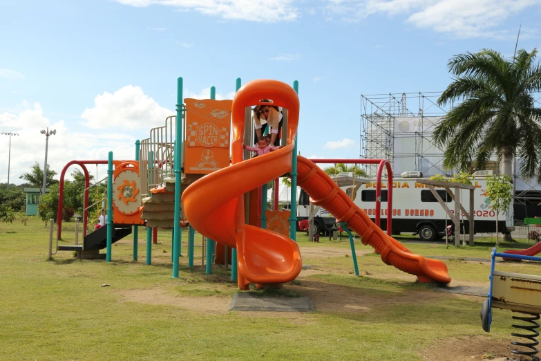 a  on a slide in a children's play ground