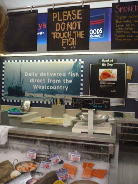 a counter at a restaurant with several plates and food