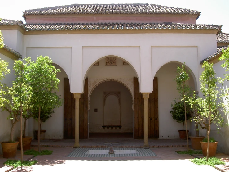 an arched entrance to a courtyard in a museum