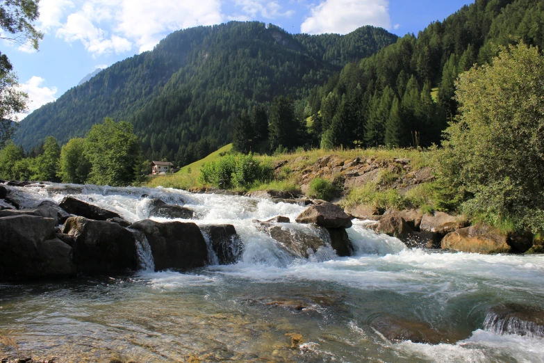 the water is running over rocks into the river