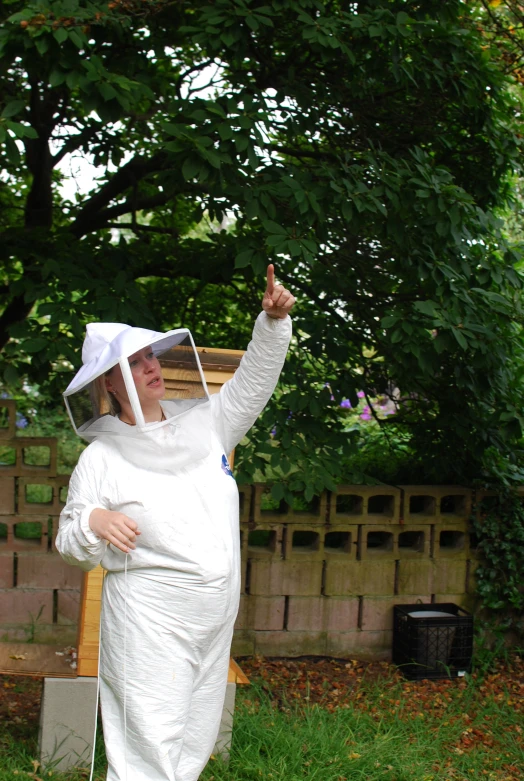 a woman in a bee suit is dressed in a veil