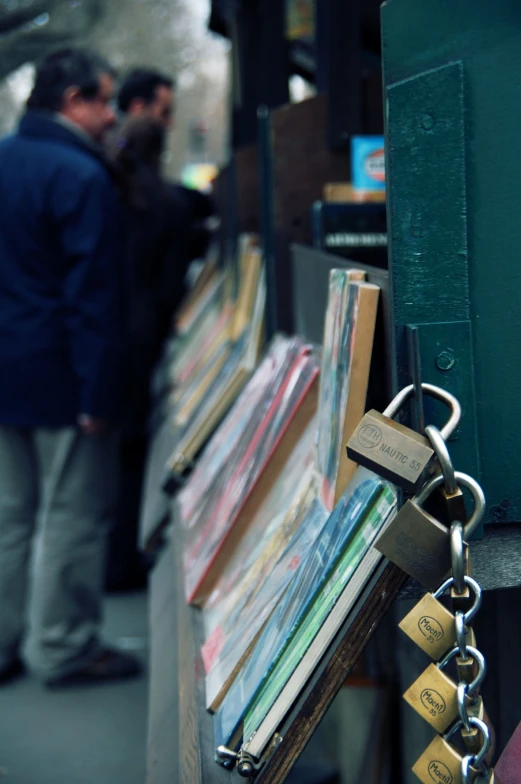 a couple of people on a sidewalk with books
