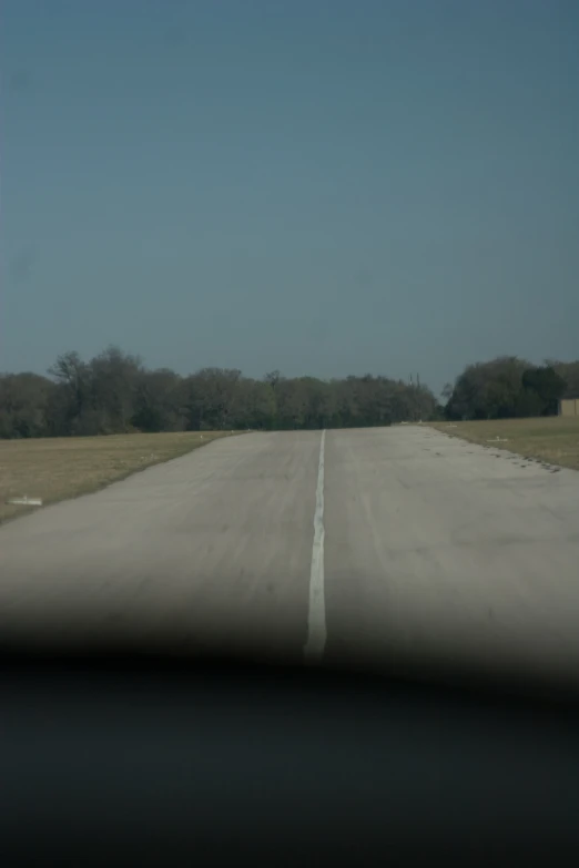 a street is empty with trees and no cars