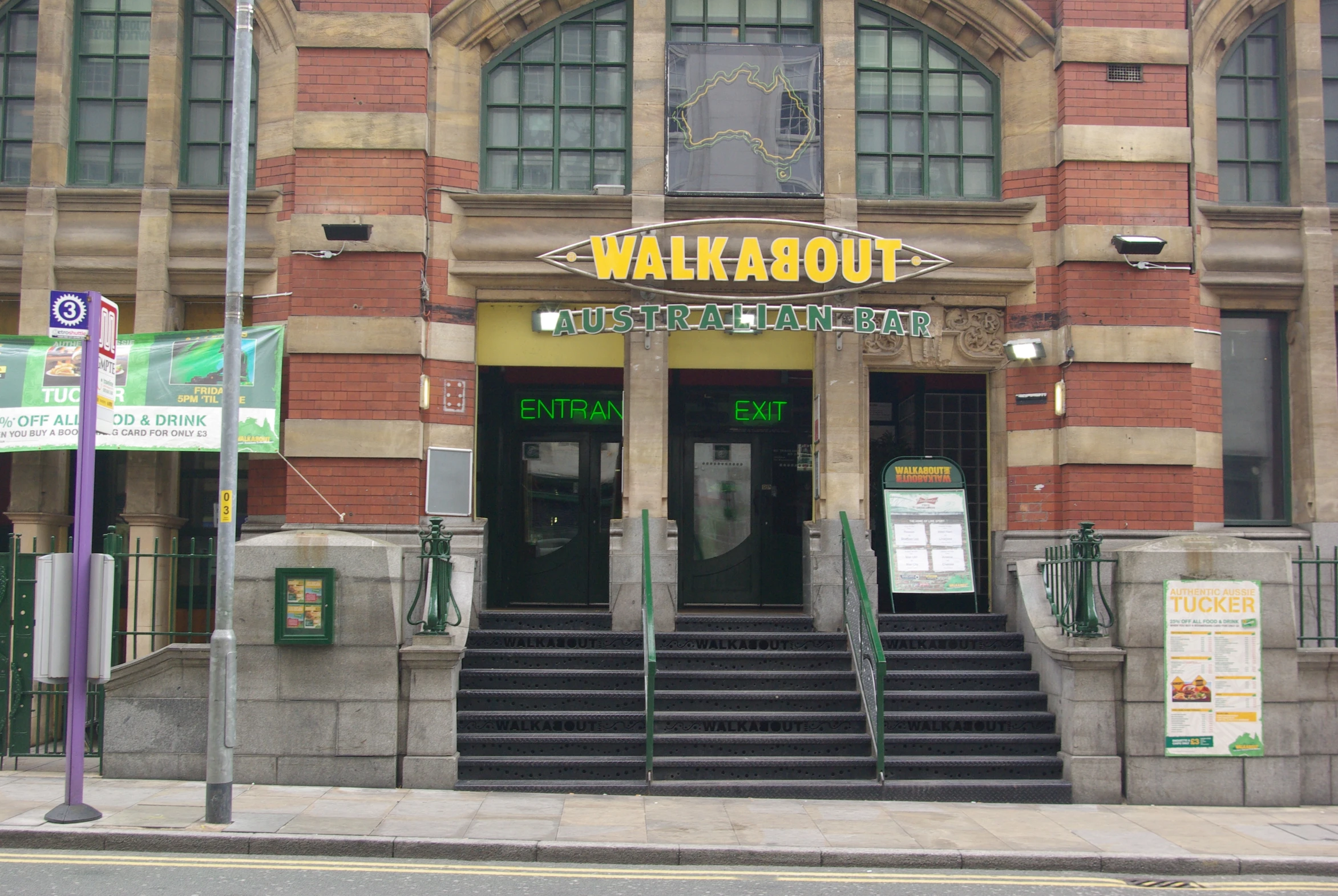 the entrance to the building with stairs leading to the entry