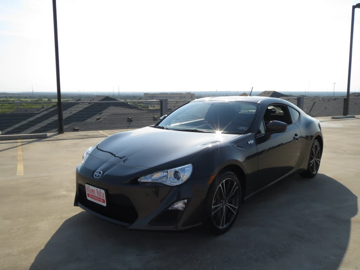 a sport car is parked in a parking lot