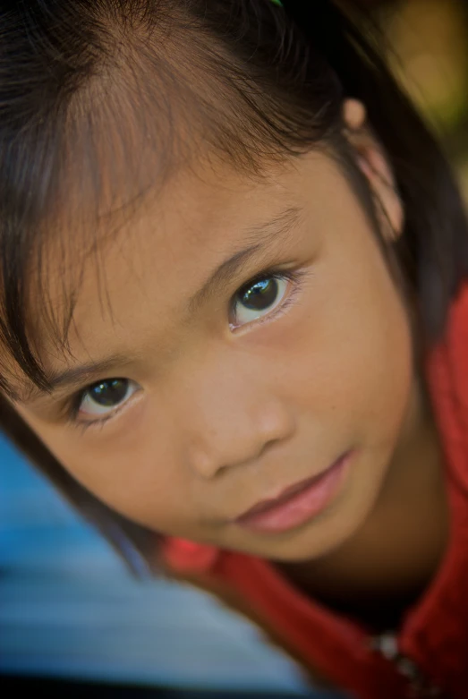 this is an adorable little girl with blue eyes