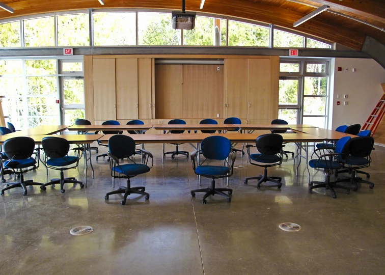 the large conference room with chairs is empty