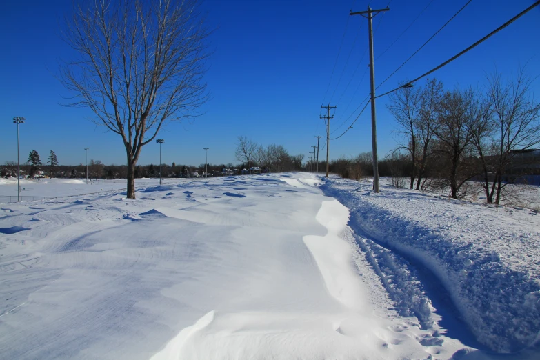 the road is covered with thick white snow