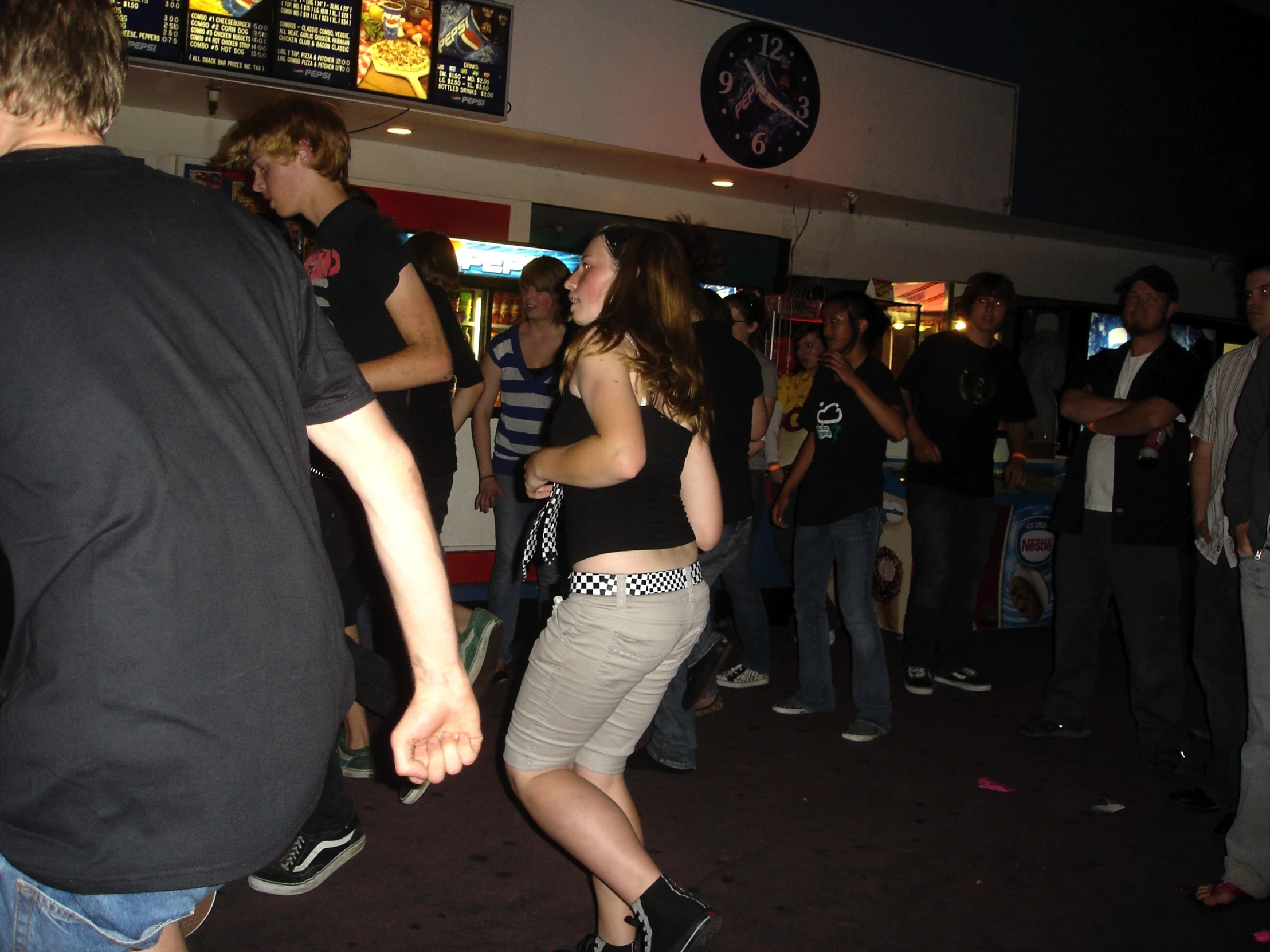 a group of people are playing in a disco