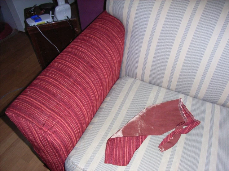 some red paper ripped off and left on the couch