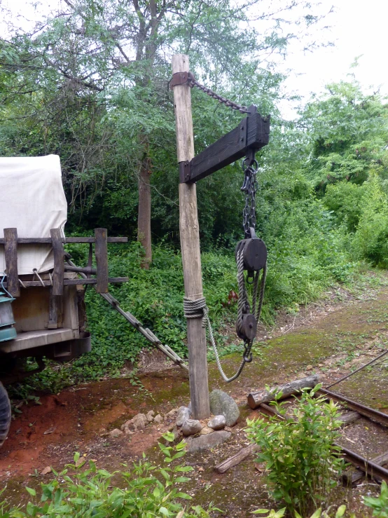 a truck that has been unloaded to make way for a lift in the woods