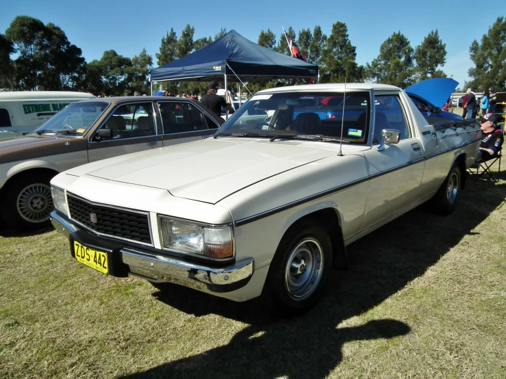 a close up of two cars near other vehicles