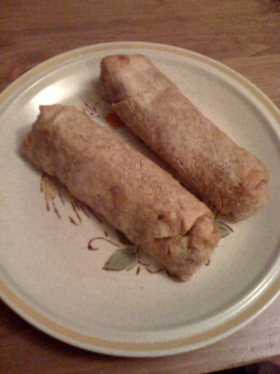 a plate on the table with a couple of pieces of food on it