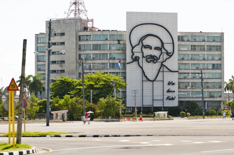 large portrait on building with man in the middle