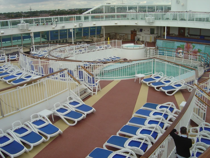 deck chairs line the deck of a cruise ship as it sits empty