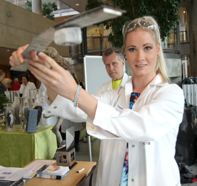 a woman with a bird on her arm