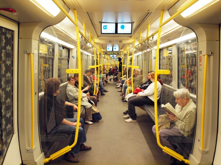 a subway train filled with passengers waiting to get on the train