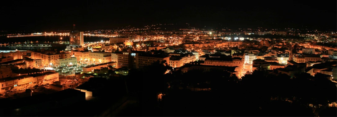 a city with some buildings and lights at night