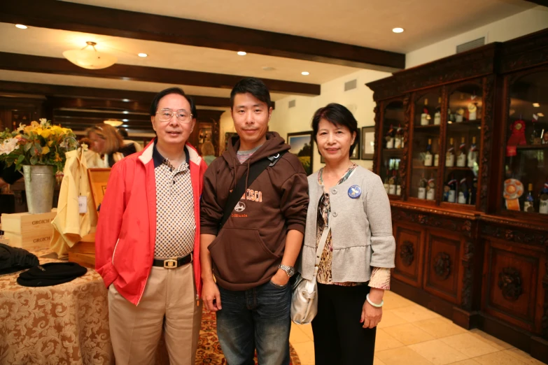 a man, two women and a man posing for a picture