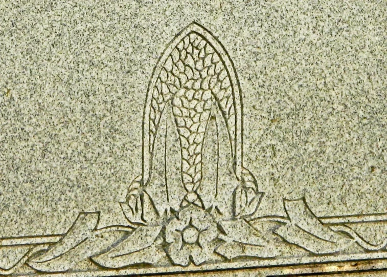 an inscription on the side of a stone in which a hand is drawn