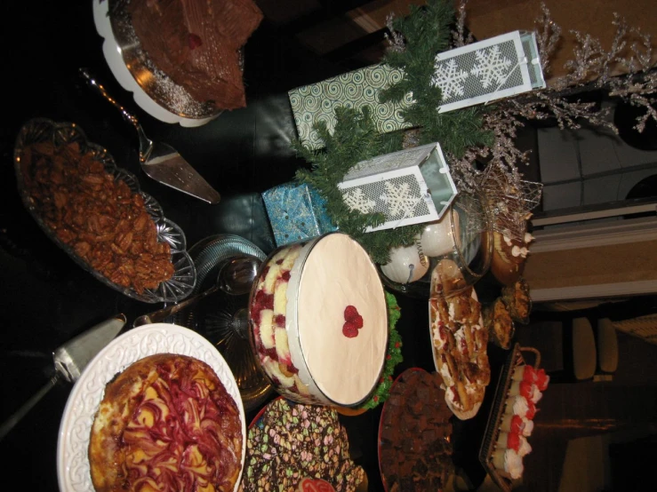 a buffet filled with lots of different pies and cakes