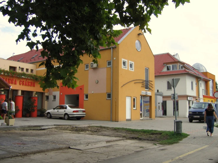 a building with orange paint and two story brown